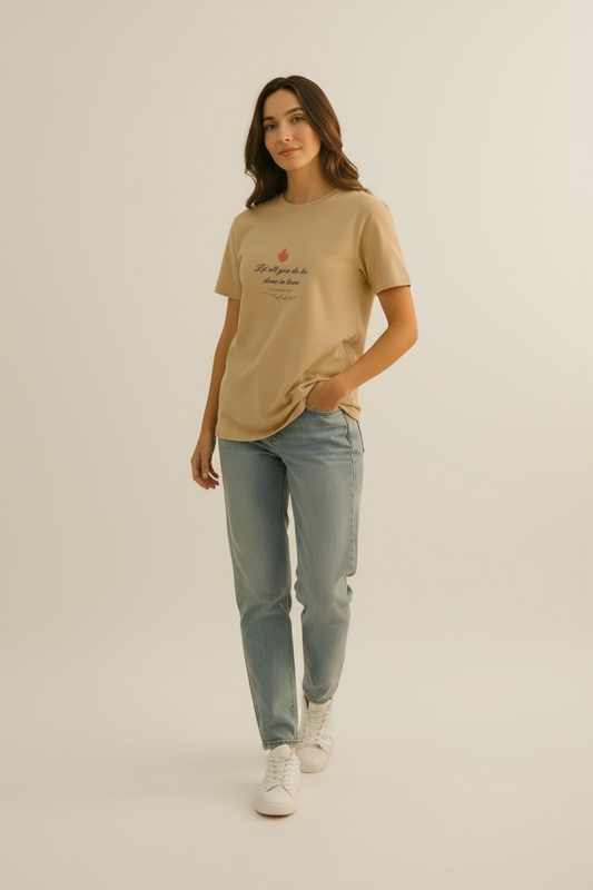 Unisex beige Christian t-shirt with Done in Love design shown in a front studio view.