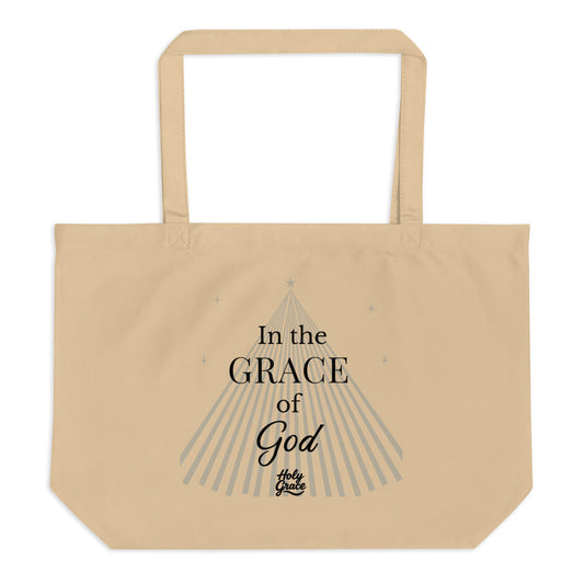 Beige tote bag with “In the GRACE of God” text, Christian faith design by Holy Grace.