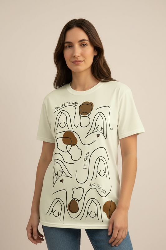 Woman wearing minimalist beige Christian tee with abstract Jesus lines – studio front view