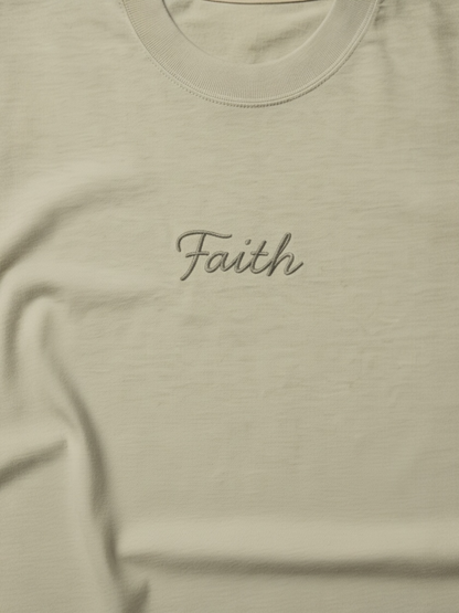Beige t-shirt with 'Faith' embroidered on it