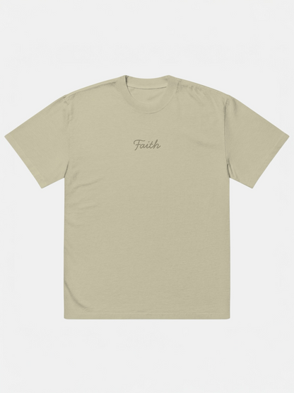 Beige t-shirt with 'Faith' embroidery on a white background