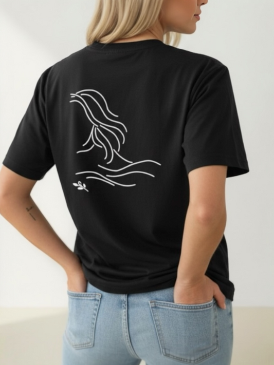 Person wearing a black t-shirt with a white graphic design on the back, standing against a plain background.