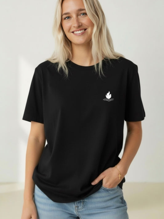Person wearing a black t-shirt with a white logo on a plain background