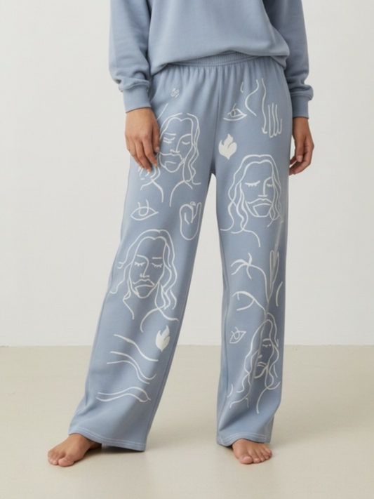 Light blue pajama set with white line art on a plain background