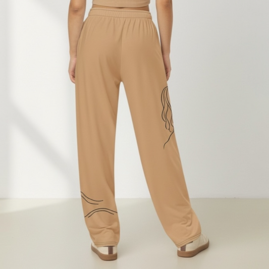 Beige pants with black abstract design on a white background