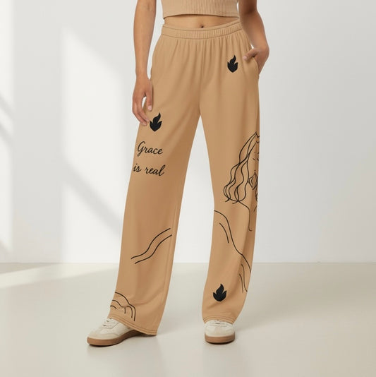Beige sweatpants with black graphics and text on a white background