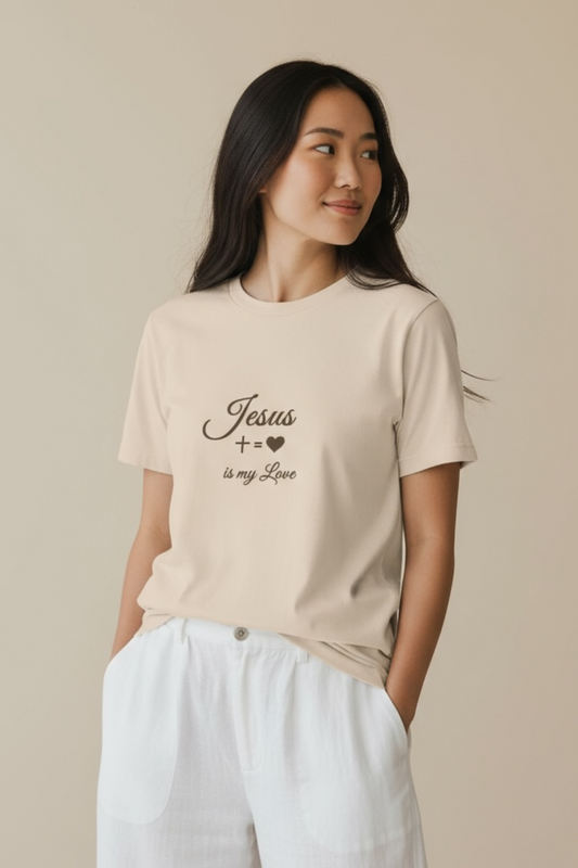 Woman wearing the beige “Jesus is my Love” tee against a neutral studio background.