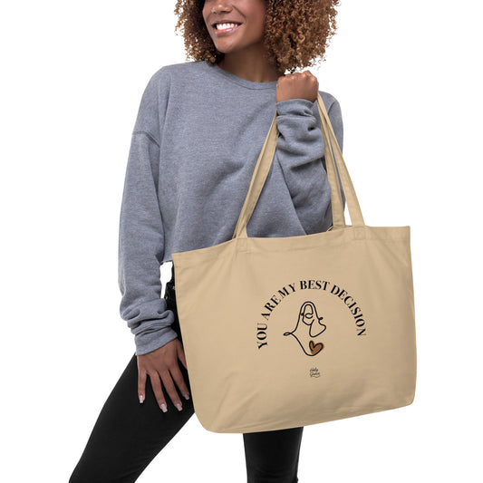 Woman holding beige Holy Grace tote bag “You Are My Best Decision” with Jesus face design.